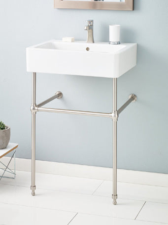 Nuovella console sink with a gloss-white fireclay basin, single-hole faucet and brass stand; illustrative finish.